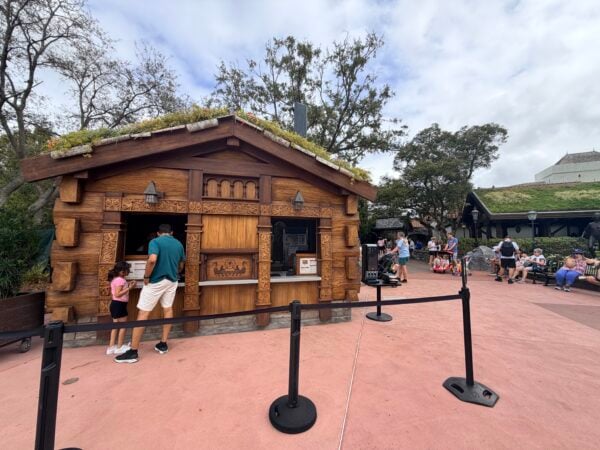 Norway Pavilion Epcot food stand with green roof and people ordering