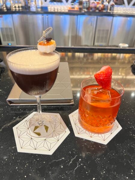 Two cocktails on the bar at GEO-82 inside Spaceship Earth at EPCOT
