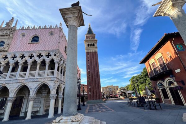 The Italy pavilion plaza at EPCOT with its bell tower and Venetian palace facade