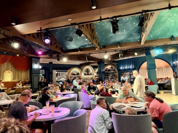 Inside Hurly-Burly, with a starry painted ceiling, plush tub chairs, and the bar window onto the BoardWalk