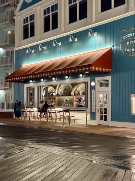 Hurly-Burly outdoor walk-up bar window with stools on Disney's BoardWalk