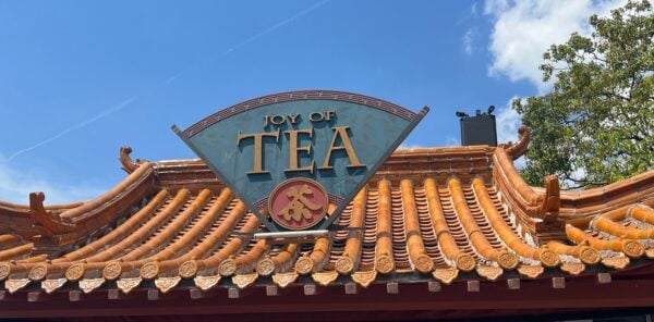 The Joy of Tea sign on the tiled roof of the walk-up stand in the China pavilion at EPCOT
