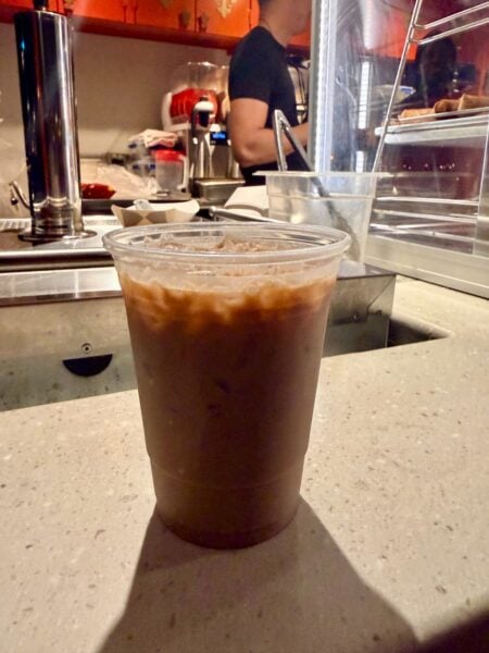 Tipsy Ducks in Love on the Joy of Tea counter, with the darker bourbon float sitting on top of the iced drink
