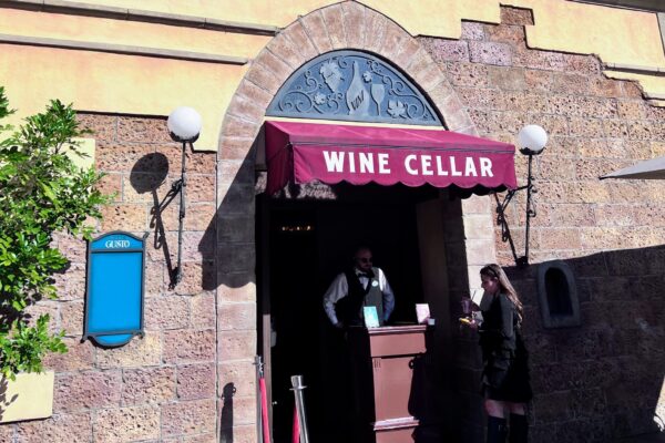 Host stand at the Tutto Gusto Wine Cellar entrance in EPCOT's Italy pavilion